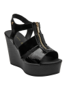 Calzado casual negro de cuero con cierre dorado, perfecto para un look urbano chic.