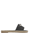 Alpargata negra con suela cosida, combinación de elegancia y casualidad.