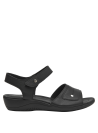 Sandalia minimalista negra ideal para uso diario y eventos casuales.