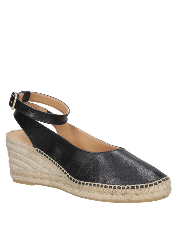 Alpargata de mujer en cuero negro con plataforma de yute, estilo casual sofisticado.