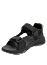 Sandalia outdoor negra con suela antiderrapante y detalle verde, ideal para caminatas.