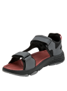 Sandalia sintética gris con tiras ajustables de velcro, ideal para caminatas urbanas y estilo casual.