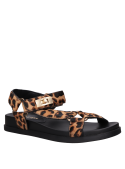 Cuero animal print en sandalia plana de mujer, estilo minimalista para un toque casual y ligero.