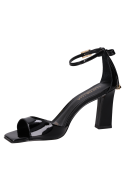 Sandalia negra de cuero con taco bloque de 8.5 cm, ideal para mujer en eventos de fiesta.