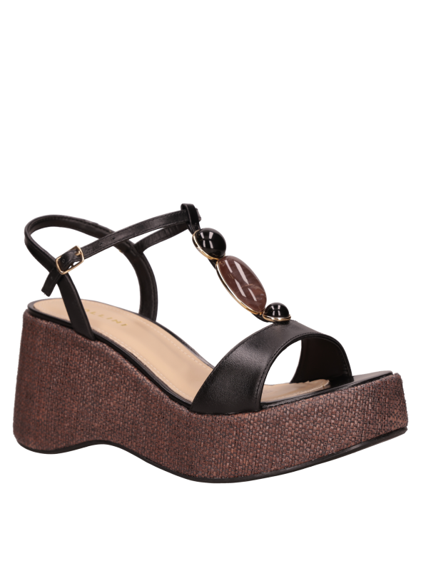 Cuña negra de cuero para mujer, perfecta para looks de día y noche.