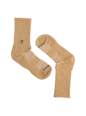 Tono neutro de calcetines unisex camel, adecuados para looks casuales y formales.