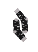 Diseño versátil de calcetines negros unisex para combinar con zapatillas o botas.