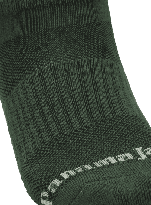 Detalle del tejido respirable de los calcetines verdes unisex para mayor comodidad. Detalle del tejido respirable de los calcetines verdes unisex para mayor comodidad.