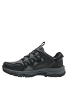 Zapatilla gris unisex con refuerzos en áreas clave para mayor protección y estabilidad.