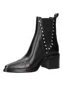 Botín negro de cuero para mujer, estilo casual, ideal para actividades urbanas.