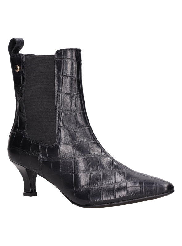 Vista superior del botín negro de cuero, resaltando su diseño fluido y glamour para la mujer contemporánea.