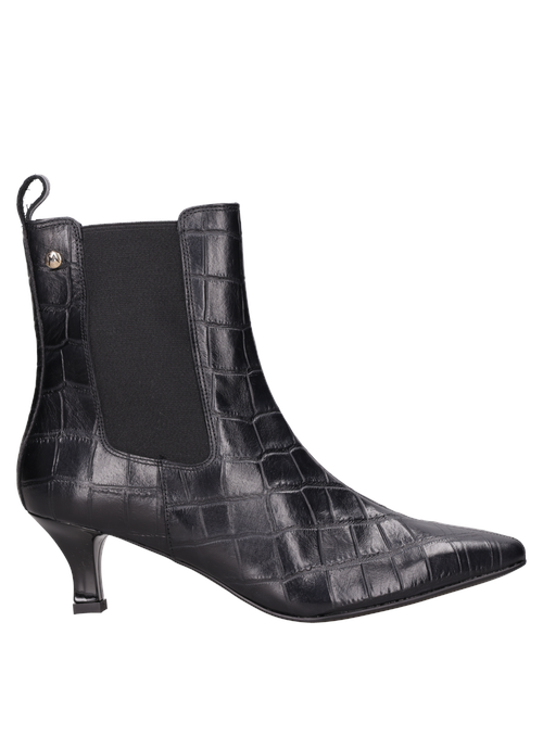 Vista superior del botín negro de cuero, resaltando su diseño fluido y glamour para la mujer contemporánea.