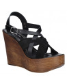 Sandalia negra de cuero para mujer, estilo casual, con hebilla ajustable en el tobillo para mejor ajuste y comodidad.